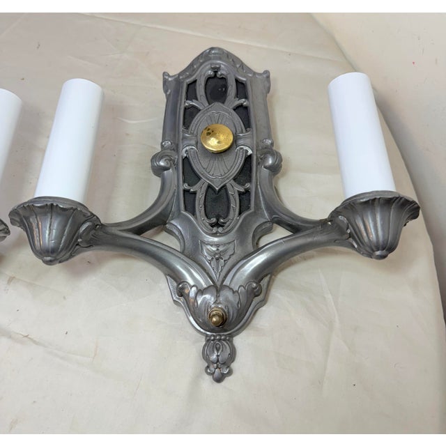 Up for sale is an exquisite pair of antique ornate 2-arm pewter electric wall sconces. These high quality fixtures feature...