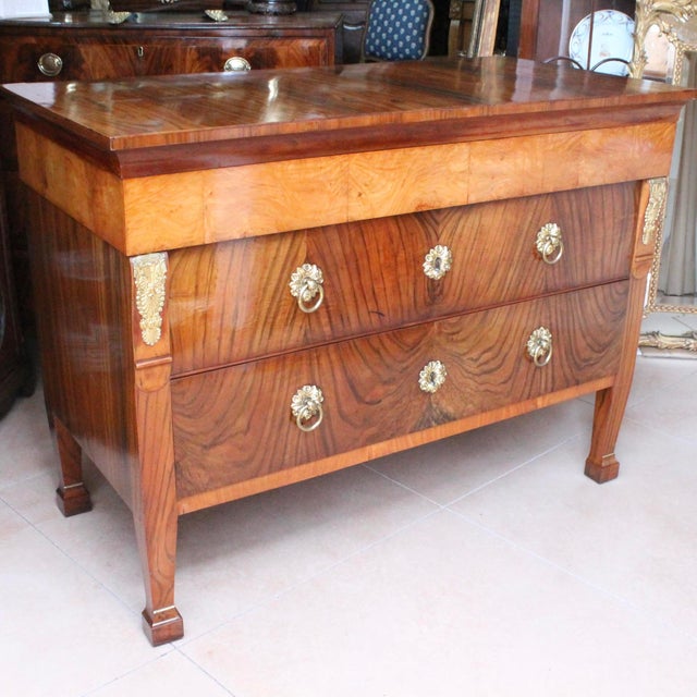 A fantastic three drawer Italian Neoclassical commode, of figured walnut and burl ash timbers, dating ca. 1810-1820. The...