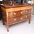 A fantastic three drawer Italian Neoclassical commode, of figured walnut and burl ash timbers, dating ca. 1810-1820. The...