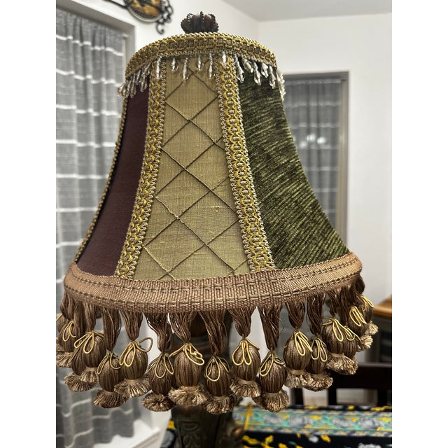 A pair of matching Resin lamps with jewel-toned, beaded lampshades. Crowned finials top the 32 inch tall lamps. Both work...