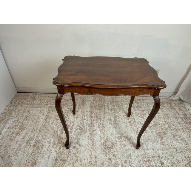 This vintage French provincial side table is a study in restrained craftsmanship, where elegant proportions and carefully...