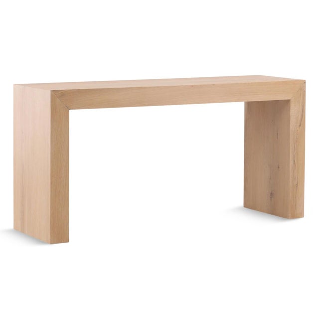 Simple solid natural light oak wood waterfall style console table. Each may vary slightly in exact coloring and wood...