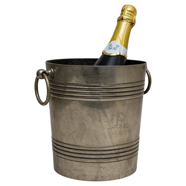 This 20th Century French silver-plated champagne bucket features a classic cylindrical form accented by engine-turned...
