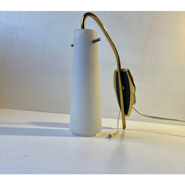 A stylish Stilnovo inspired Wall light. Its made from brass with textured black paint (leather texture) and mounted with a...