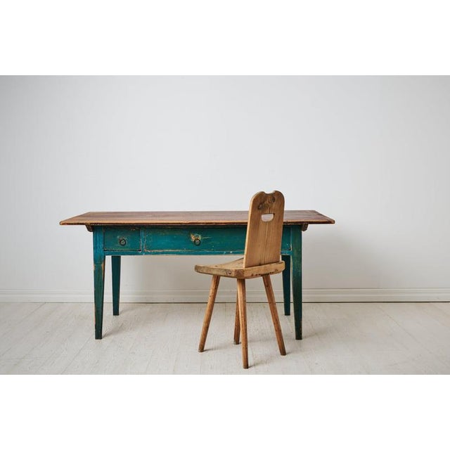Genuine large country table from the 19th century. Made by hand in northern Sweden around 1840. Straight tapered legs and...