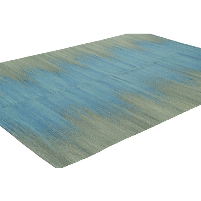 Handwoven in wool, this 7x9 Kilim is from an inventive new contemporary flat weave collection by Rug & Kilim. On the...