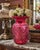 A beautiful vintage Fenton Art Glass vase crafted in rich cranberry glass and featuring the highly collectible Coin Dot...