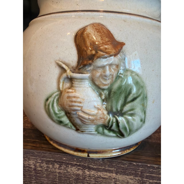 1940’s humidor/tobacco jar form English stone ware maker. Depicts a drunkard. Rare and in pristine condition.