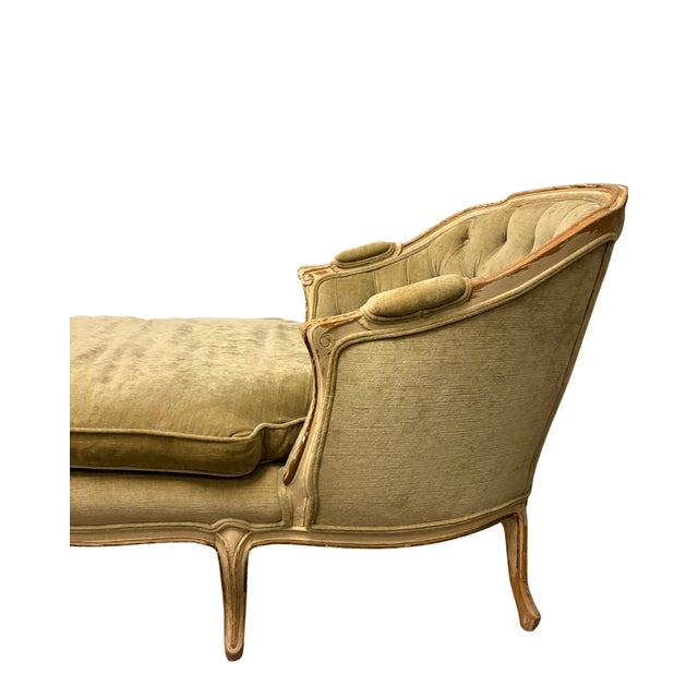 Hand-carved hardwood frame with deep button tufting and original horsehair upholstery beneath velvet. A refined French...