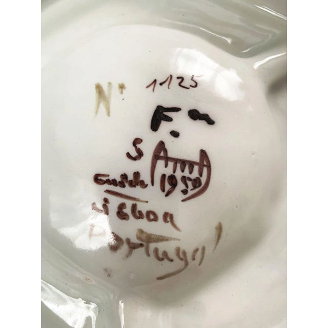 The Portugal Coimbra Signed Hand-Painted Coat of Arms Ashtray, dated 1959, is a fine example of traditional Portuguese...