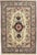 Antique hand-knotted Persian Mashad wool rug with an ivory field centered by a floral medallion, surrounded by delicate...