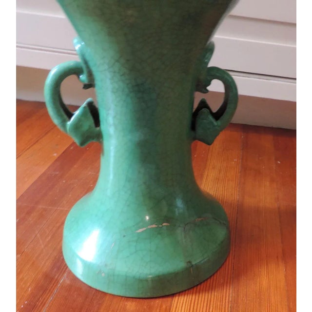 Large 19th c. Chinese porcelain baluster shaped urn with green crackle glaze. Elephant ring handles to the sides. Measures...