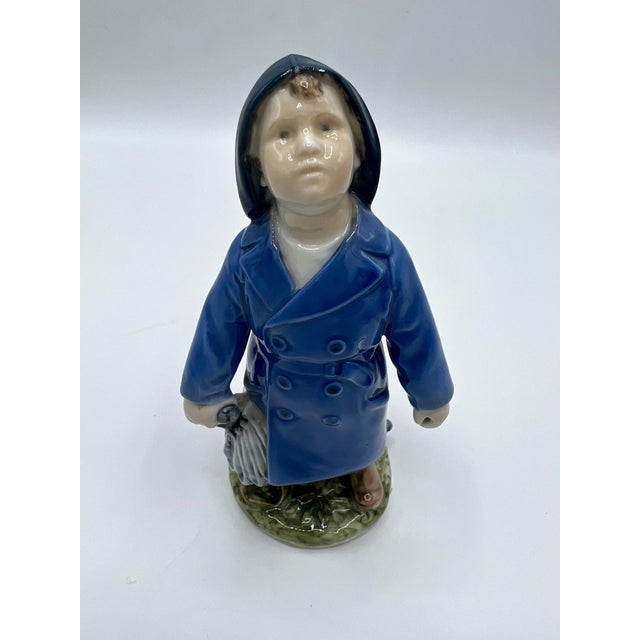Sweet Royal Copenhagen figurine “Boy with Umbrella” No. 3556