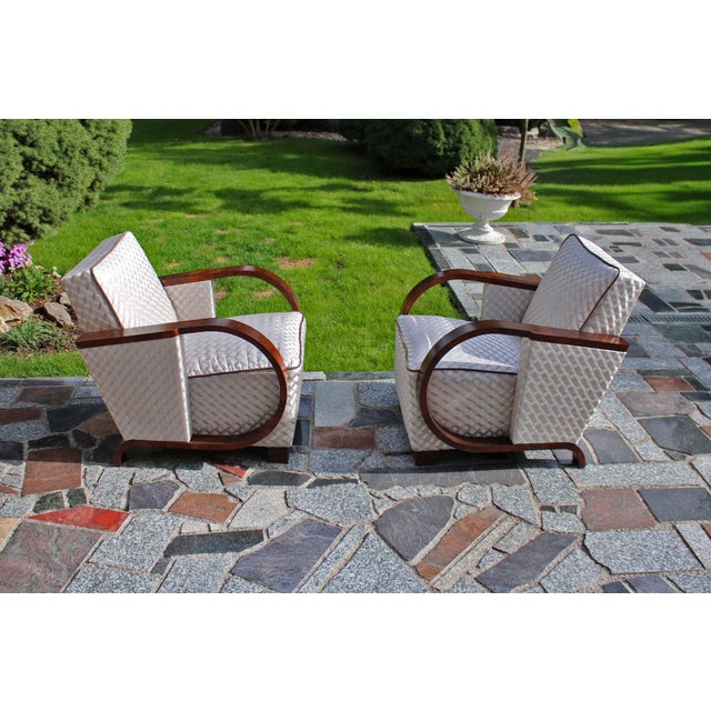 A beautiful set of 2 Art Deco armchairs. They were completely restored to their original beauty, with great care.