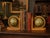 Charming vintage pair of wooden globe bookends featuring rotating Old World-style globes with beautifully aged...