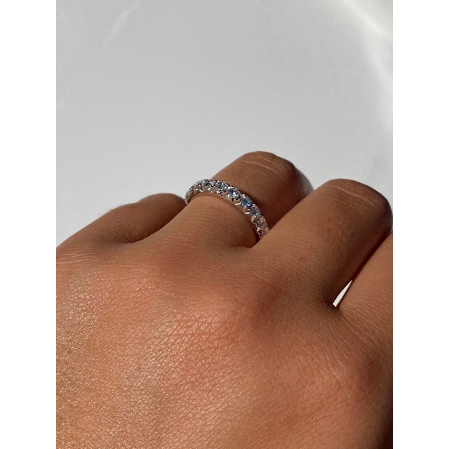 The 9th Street: French Set Natural Diamond Band in White Gold. The band features French set round brilliant cut natural...