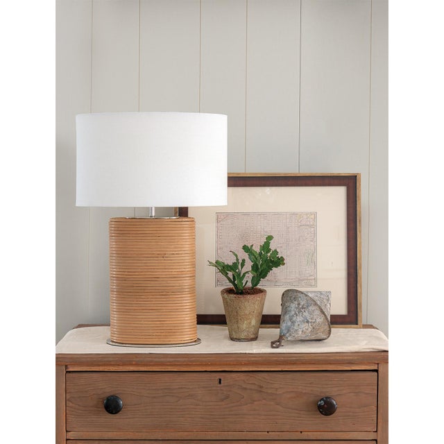 The Resort Bedside Table Lamp redefines style with its distinctive design featuring a bamboo-wrapped base, adding a unique...