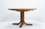 Round extendable dining table by Ebenisterie Seltz, produced in the 1980s in France, crafted in solid European elm. The...
