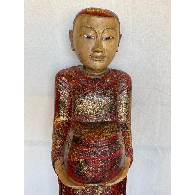 Vintage Buddha Buddhist Carved Wood Burmese Thai Monk Statue in good estate condition. There are nicks to the base's...
