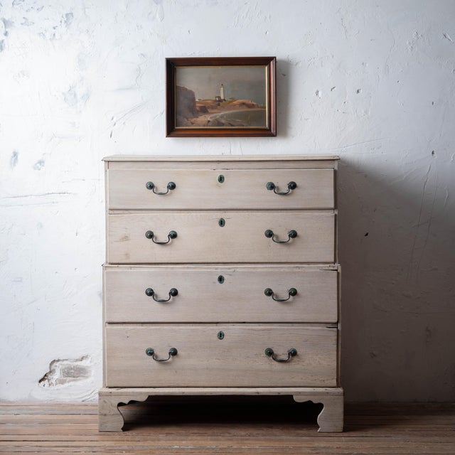 Georgian bleached oak chest-on-chest, circa 1780. Upper and lower chest each with two graduated long drawers, fitted with...
