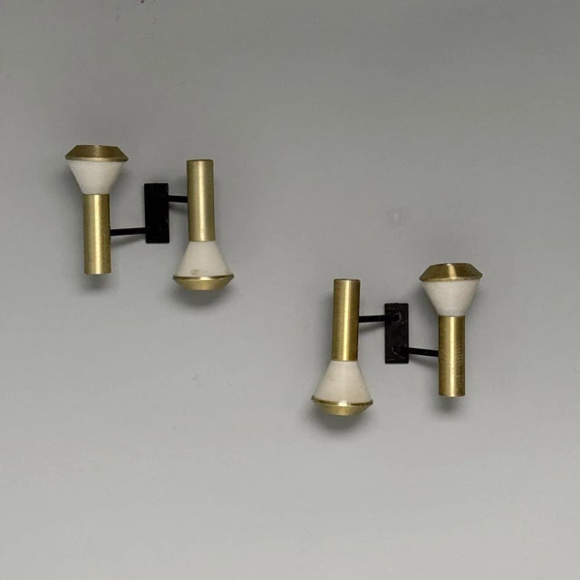 Stilux, Italian Mid-Century Modern, Wall Sconces or Wall Lights, Brass, Aluminum, Italy, 1960s This elegant pair of...