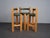 A distinctive set of three architectural bar stools from the 1990s, defined by strong vertical lines, bold proportions and...