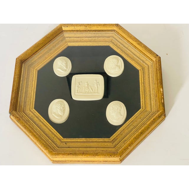Italian Grand Tour Set of 5 Neoclassical Plaster Intaglios in a golden octagonal frame.