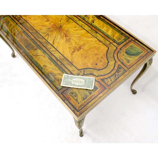 Decorative Hollywood Regency solid brass and heavy paint decorated marble-top insert rectangular coffee table.