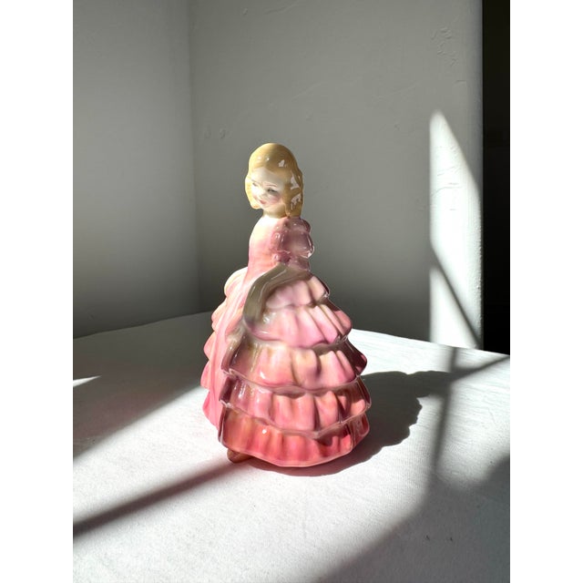 Royal Doulton “Rose” HN 1368 Figurine An elegant early Royal Doulton study in femininity and grace, Rose HN 1368 embodies...