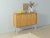 Wonderful chest of drawers from the 1960s. High-quality body in bleached teak veneer with two closet doors, a shelf and...