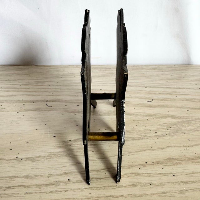 This vintage Israeli brass napkin holder features a richly detailed Star of David form, hand-finished with vibrant enamel...