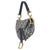 Designed by John Galliano in 1999, Dior's saddle bag made its debut on the SS00 runway. The cowboy-inspired accessory has...
