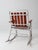 Vintage mid-century folding rocking chair combining a lightweight aluminum frame with warm wood slats for a timeless...