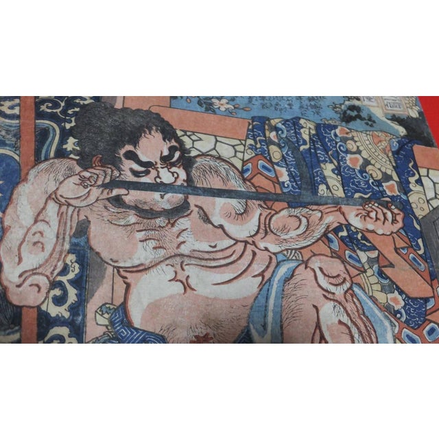 An original woodblock print by Utagawa Kuniyoshi (1797-1861) from his celebrated Suikoden (Water Margin) series, depicting...