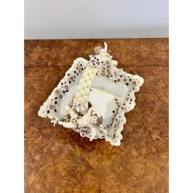 Fantastic quality antique Victorian porcelain basket having a wonderful basket with cherubs to either side of the handle...