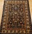 "This antique Persian Malayer rug from the early 1900s presents the classic Herati allover design in a deep navy-blue...