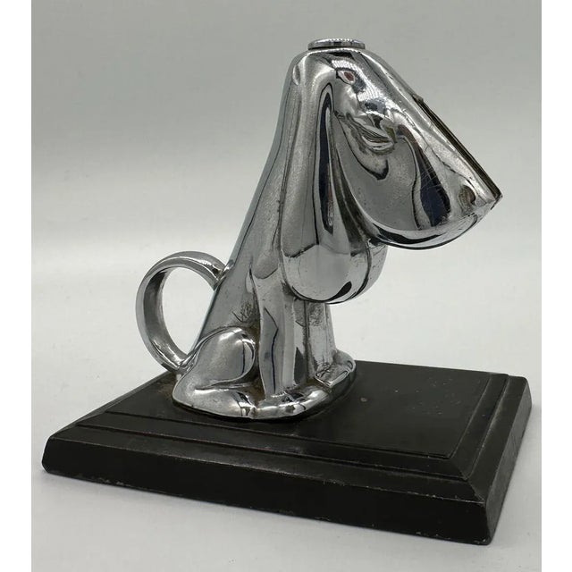 In 1935, a desk-mounted striker lighter was crafted. It featured a basset hound canine adorned with a layer of chromium...