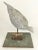 Whimsical sculpture of a curios bird on simple painted wood stand. Painted fiberglass bird on metal post with wood base....
