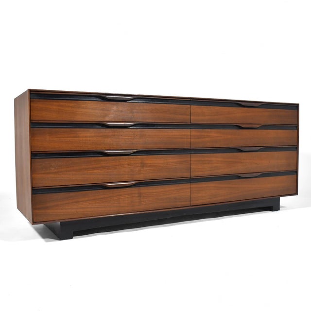 A great design with several subtle details, this walnut dresser designed by John Kapel for Glenn of California features...