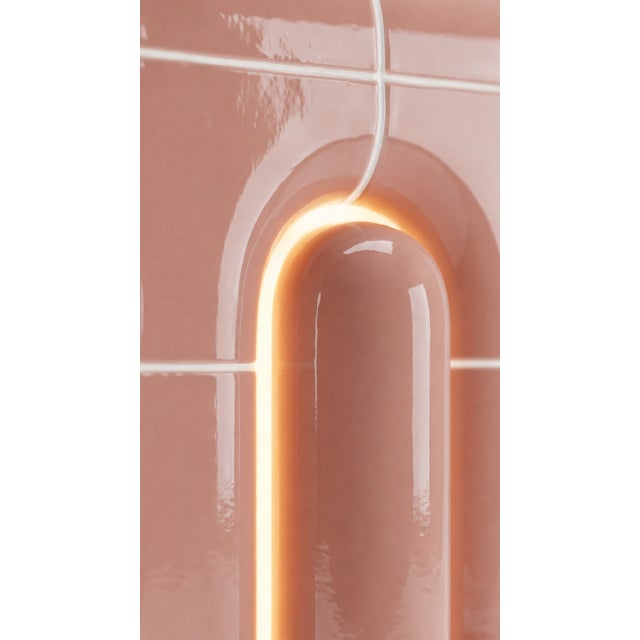 The smallest lamp in the collection, and often the first one people reach for. Its folded form hides the source entirely,...