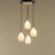 Italian mid-century ceiling light featuring four gracefully tapered pendants in whitematte opaline glass, suspended from...