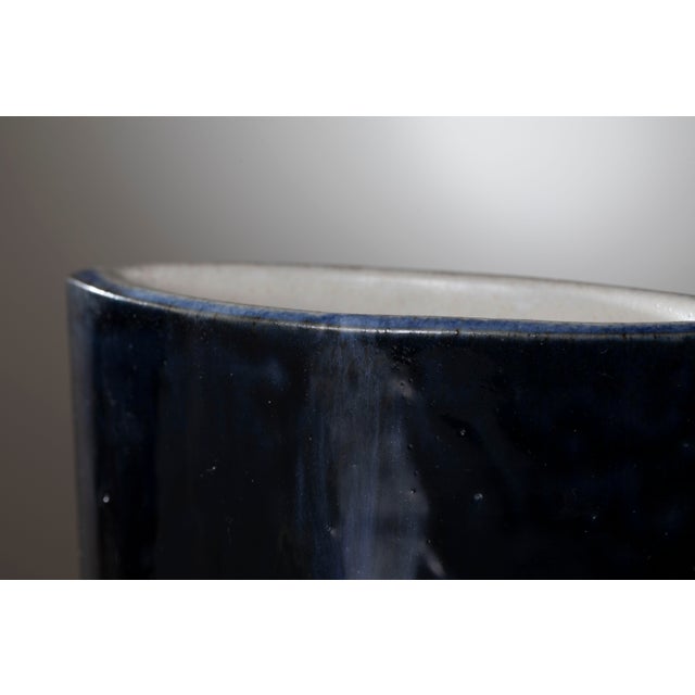 An exceptional and highly architectural studio pottery vase, designed and handcrafted by the prominent Italian ceramicist...