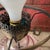 This vintage lamp set features pink hobnail glass bases paired with ornate metal stands, blending antique charm with...