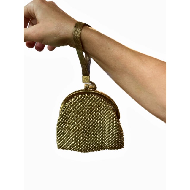 Art Deco Flapper style gold beaded wristlet bag with gold mesh handle. Satin interior. Circa 1920s.