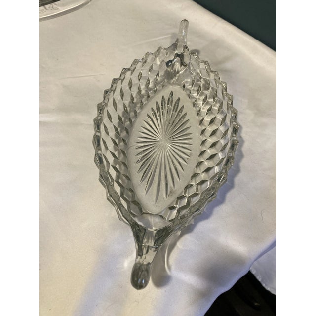 A classic example of Fostoria's beloved "American" pattern, this elongated crystal dish features a sea of precise diamond-...