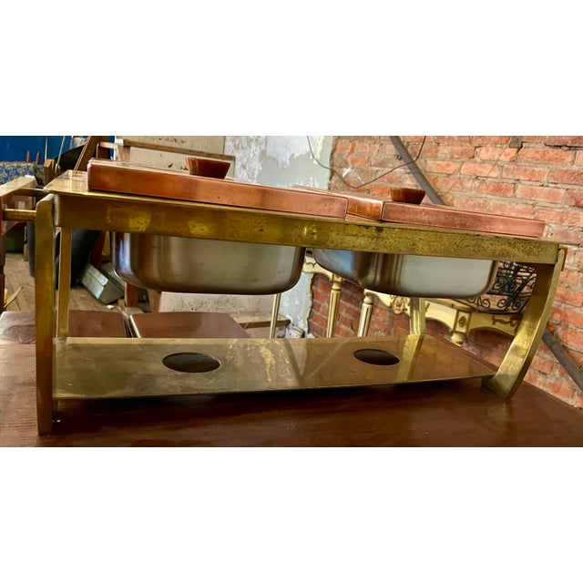 Here is a beautiful mid century industrial style double food server which is made of brass with copper covers, stainless...