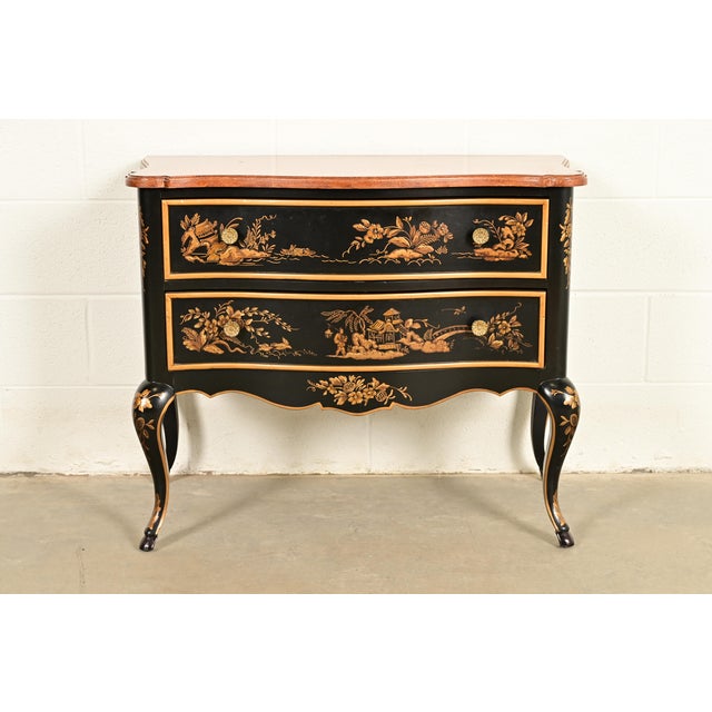 A gorgeous Hollywood Regency Chinoiserie commode or chest of drawers By Drexel Heritage USA, Circa 1970s Black lacquered...