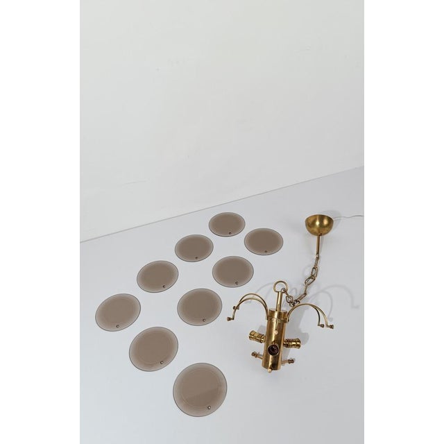 Super glamorous chandelier that recalls the smoky clubs of the 70s in Rome such as Gilda or Piper, and Rome is in fact the...