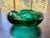 Heavy (2.5 pounds) emerald green bubble glass ashtray. Unmarked. 5.5" diameter, 2.5" high