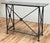 Stunning vintage stone top wrought iron console table. Features heavy architectural style frame with unique detail to...